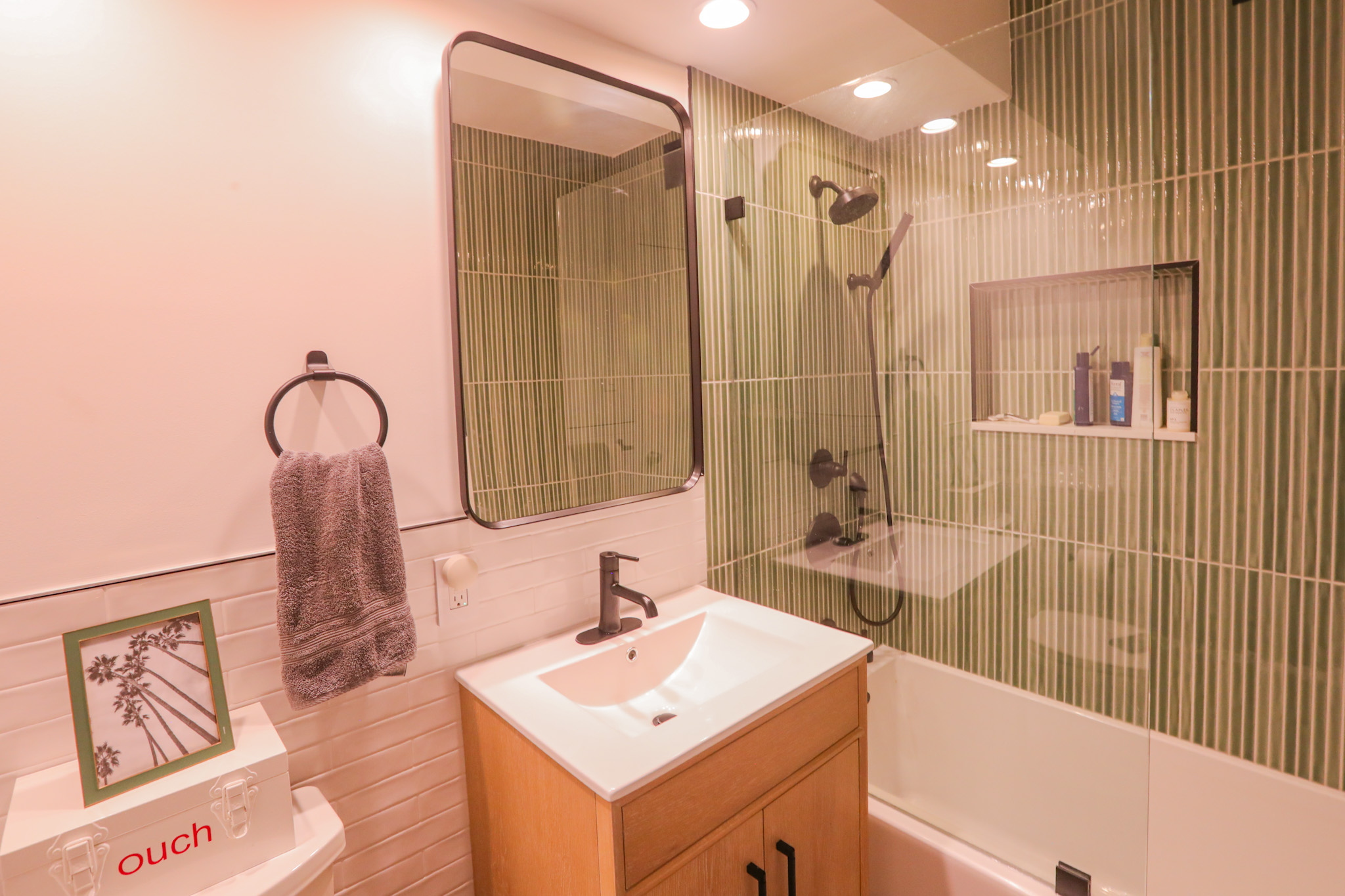 Bathroom — floor-to-ceiling sage green vertical tile